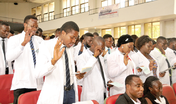  The students taking their oath in their white coats